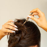 Pic à cheveux Peignée